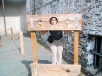 Sandra in the stocks at the museum