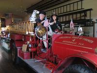 Sandra and Stan trying to be firemen at Firehouse Museum, Jacksonville